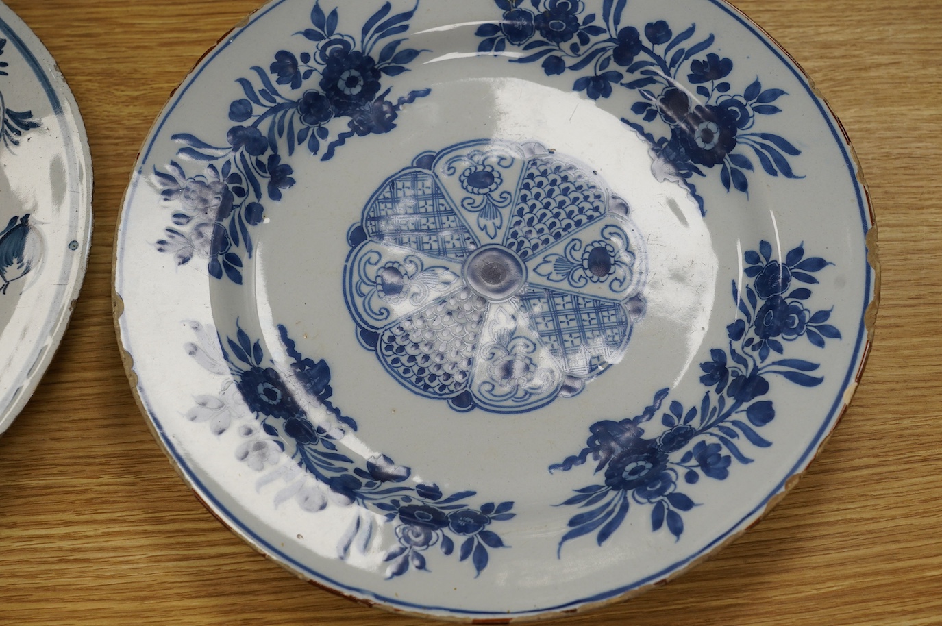 Five various delft dishes, largest 37cm diameter. Condition - poor to fair